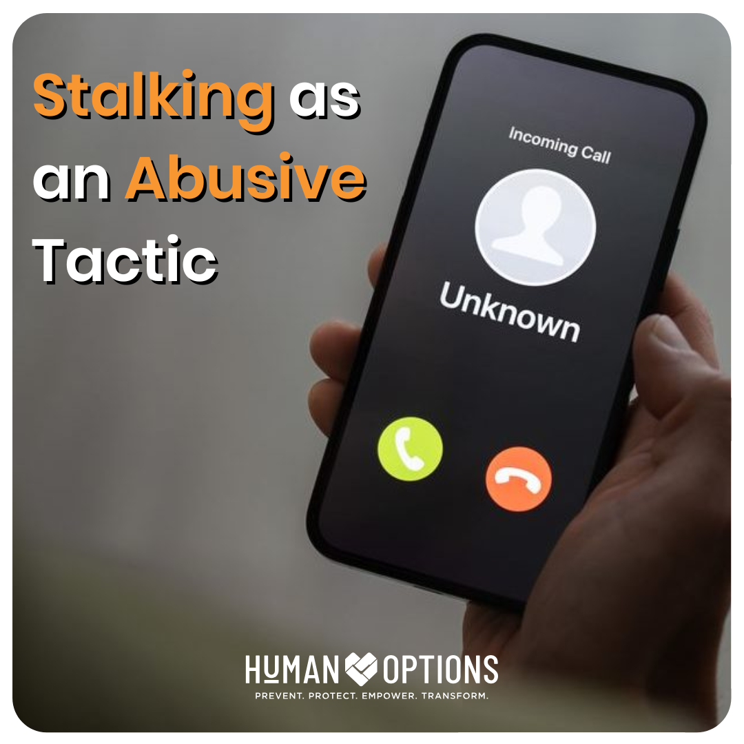 Photo of hand holding cell phone with incoming unknown caller. Titled Stalking As An Abusive Tactic.